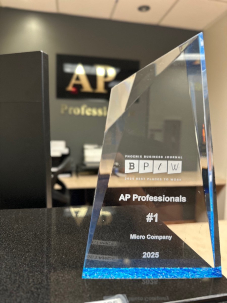 2025 Phoenix Business Journal Best Places to Work award: AP Professionals, #1 Micro Company, with the AP sign behind it